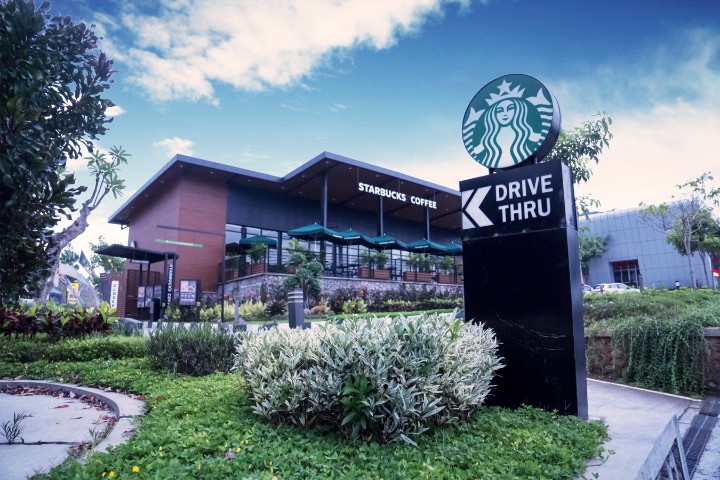 Starbucks coffee shop with a drive-thru sign
