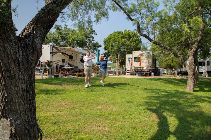 Happy couple walking together at Miller Creek RV Park in Texas Hill Country